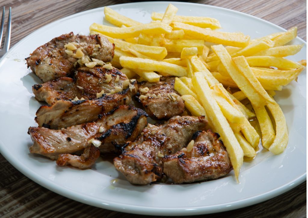 Lagartos de porco únicos servidos do restaurante O Gouveia